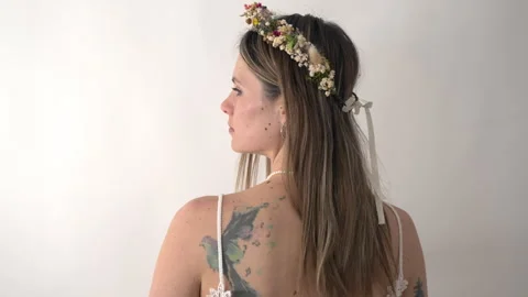 Camera tracks forwards, approaching a bride that has her back towards the Stock Footage 316204151