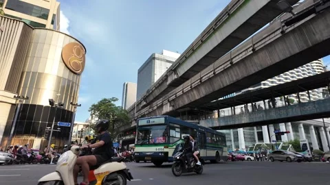 Camera tracks old Thai bus along Ratchadamri Road in ultra slow motion Stock Footage 300947721