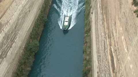 Camera tracks a small boat sails along the Corinth Canal Stock Footage 63194711