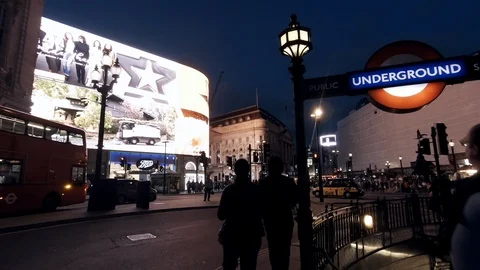 Camera tracks from the surface of Picadilly Circus down to the London Undergroun 스톡 동영상 93755248