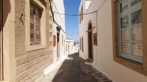 Camera tracks through a narrow street Hora on Patmos Stock Footage