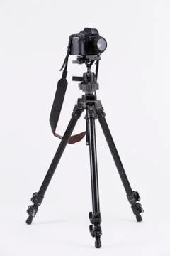 Camera with tripod Stock Photos