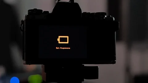 The camera on the tripod in the photo Studio shows that it has run out of Stock Footage 122336211