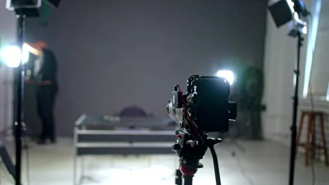 A camera on the tripod stands set in the studio. Stock Footage 307857667