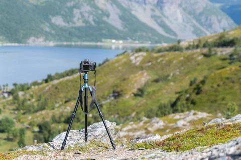 Camera on a tripod taking picture Stock Photos