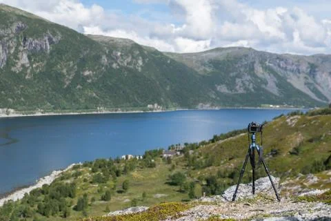 Camera on a tripod taking pictures Stock Photos