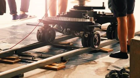 Camera trolley or camera dolly cart rails for filmmaking on studio shooting.. Stock Photos