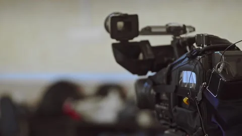 Camera in tv studio during tv recording. irrl event being filmed on professional Stock Footage 136374354