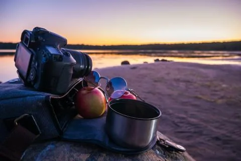 Camera, two apple, glasses and a mug of coffee. Stock Photos
