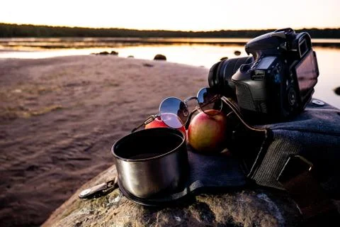 Camera, two apple, glasses and a mug of coffee. Stock Photos