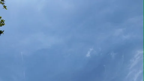 Camera video of blue sky with soft clouds drifting in daylight Stock Footage 325650159