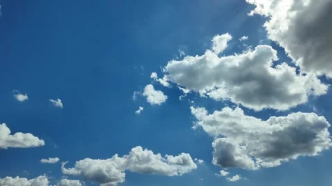 Camera video of bright blue sky with moving clouds Stock Footage 325559220