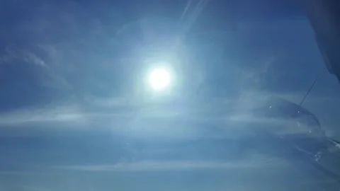 Camera video of bright blue sky with sun shining Stock Footage 325720481