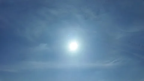 Camera video of bright blue sky with sun shining 스톡 동영상 325720485
