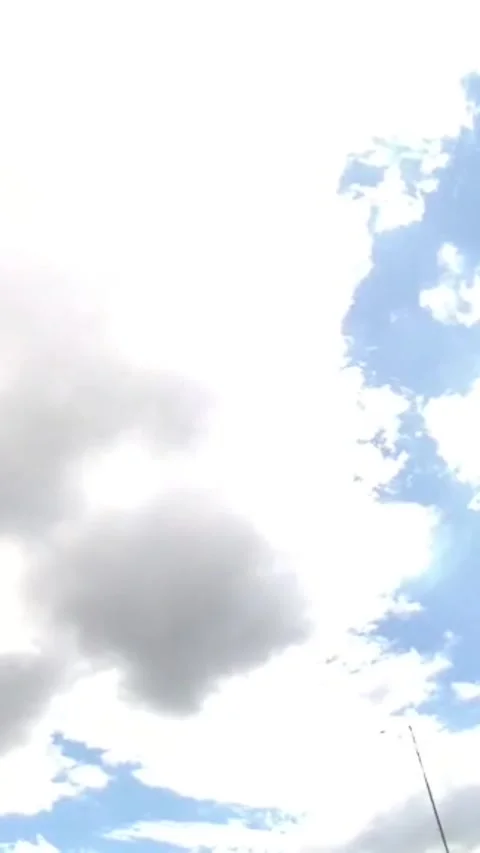 Camera video of bright sky with moving clouds in daylight Stock Footage 325650053