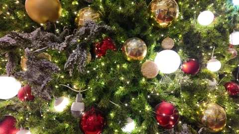 Camera video of Christmas tree decorated with glowing ornaments Stock Footage 325648950