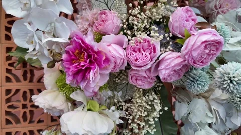 Camera video of decorative pink flower wall arrangement Stock Footage 325560874