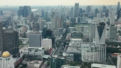 Camera video of dense city skyline under cloudy sky Stock Footage 325789888