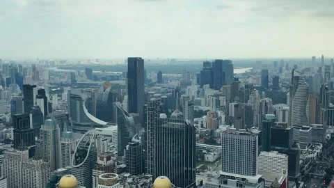 Camera video of dense city skyline under cloudy sky Stock Footage 325789889