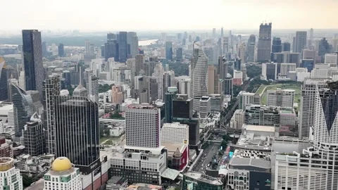 Camera video of dense city skyline under cloudy sky Stock Footage 325789893