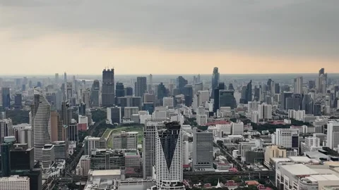 Camera video of dense city skyline under cloudy sky Stock Footage 325789913