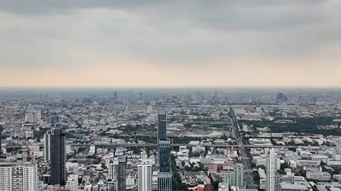 Camera video of dense city skyline under cloudy sky Stock Footage 325789917