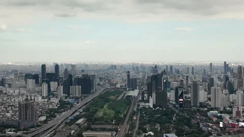Camera video of dense city skyline under cloudy sky Stock Footage 325789923