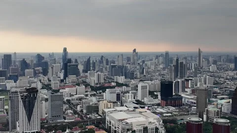 Camera video of dense city skyline under cloudy sky Stock Footage 325789925