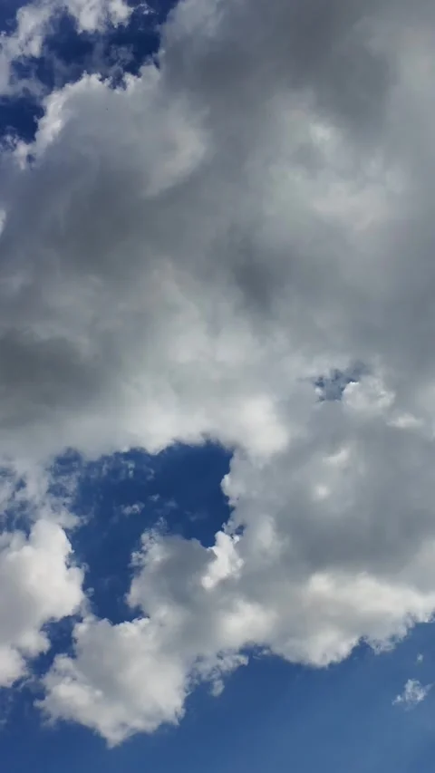 Camera video of dramatic clouds moving across blue sky Stock Footage 325650272