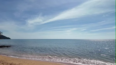 Camera video of tranquil sea with sunlight reflection under blue sky 스톡 동영상 325650153