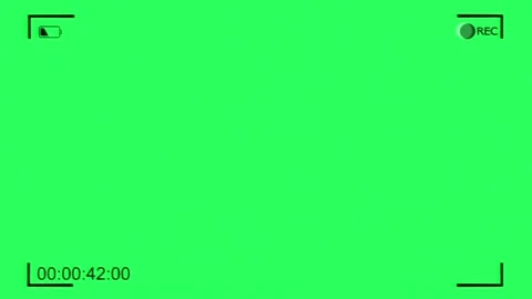 Camera viewfinder recording black text of a timer on green screen frame Stock Footage 311004523