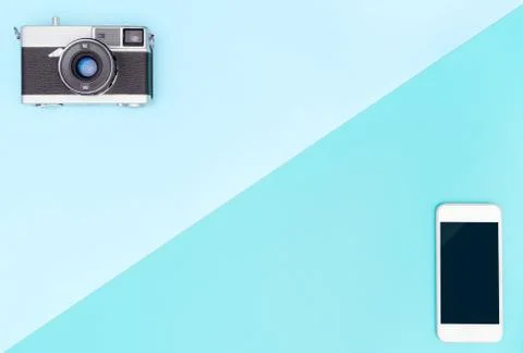 Camera VS smartphone with blue copy space 库存照片