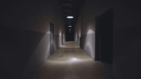 Camera walking in the path inside prison with cells Stock Footage