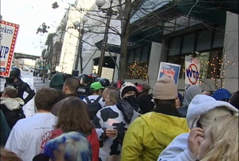 Camera Weaving Through Protesters at WTO Protests Stock Footage 106818671
