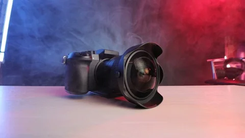 Camera with a wide angle lens on the table in the smoke Stock Footage 119699346