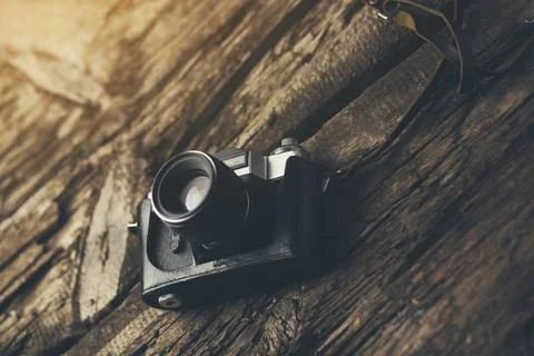 Camera on wood table background Stock Photos