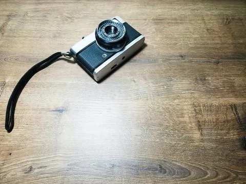 Camera on Wooden Table Stock Photos