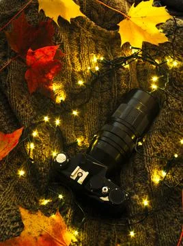 Camera on a wool sweater Stock Photos