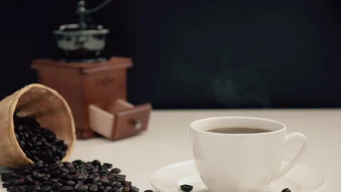 Camera zoom in hot black coffee in white cup with smoke Stock Footage 106700183