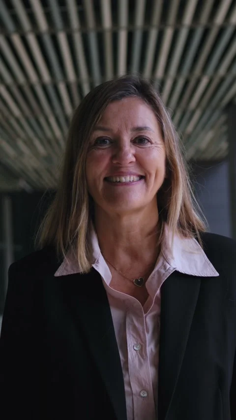 Camera zoom middle-aged Caucasian formal business woman looking smiling at Stock Footage 277121560