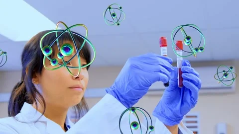 Camera zooming, atom overlay appearing, female student lifting and checking red Video stock 333936603