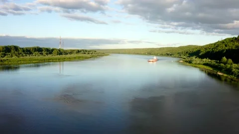 The camera zooms in on a boat on the river Stock Footage 158096943