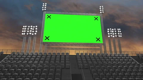 The camera zooms into a a jumbotron green screen in a stadium. Stock Footage