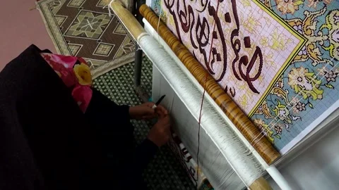 The camera zooms in on the weaving process capturing, stock footage. Stock Footage 304829502