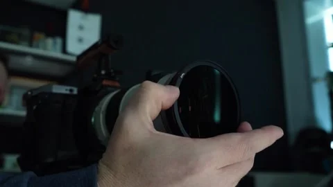 Cameraman adjusting camera before filming. Shooting with red camera. Close-up Stock Footage 230642924