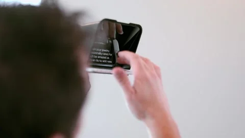 Cameraman is adjusting teleprompter on the camera Stock-Footage 131549746