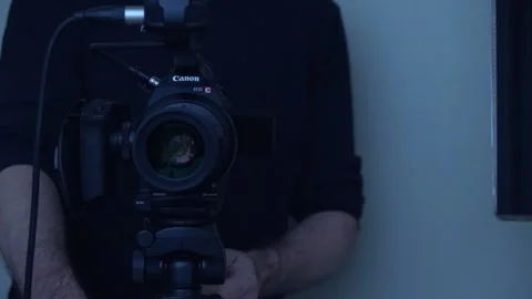 Cameraman Adjusts Camera Stock Footage 170804496