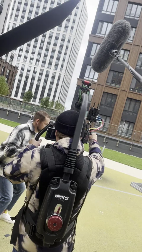 Cameraman adjusts focus to capture startled expression of man Stock Footage 303065031