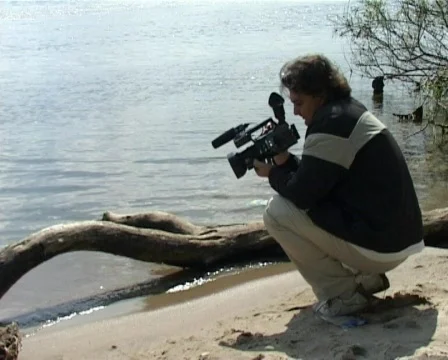 Cameraman on the bank Stock Footage 298300