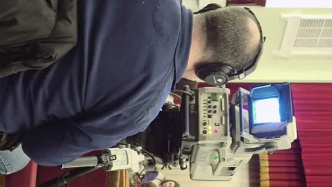 Cameraman with a big TV broadcast camera Stock Footage 91151553